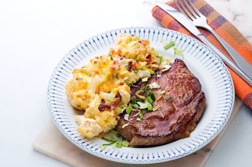Pork shoulder chops with cauliflower au gratin