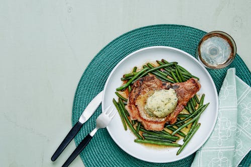 Pork chops with green beans and garlic butter